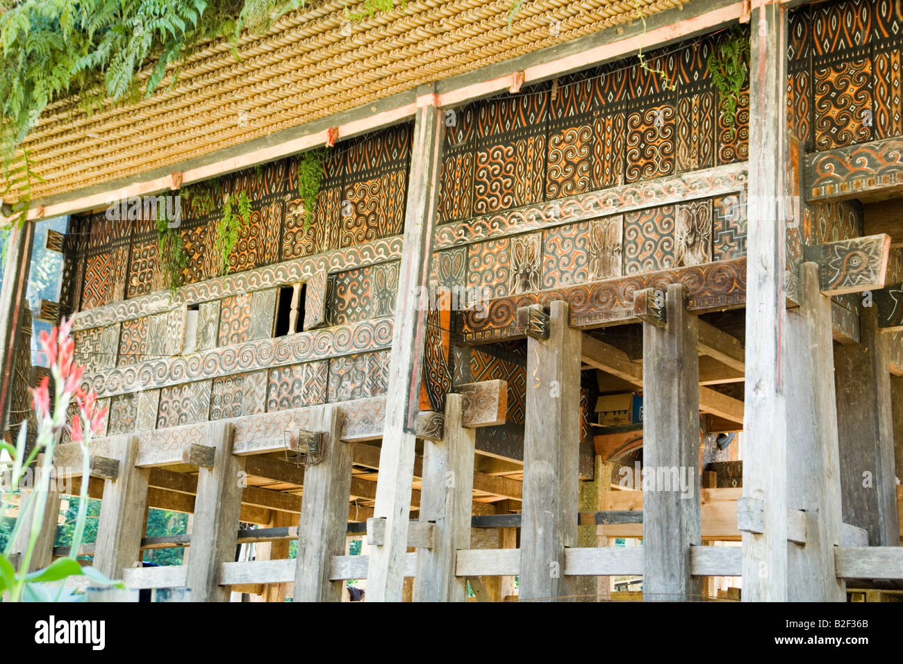 At Lemo, the carved and painted wall detail of an old Torajan house (Sulawesi - Indonesia). Stock Photo