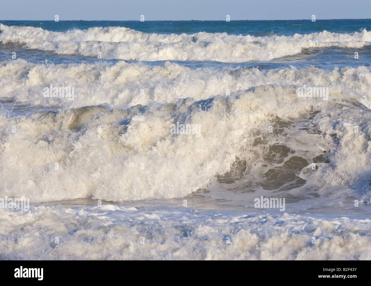 Wild waves crashing on shore Stock Photo