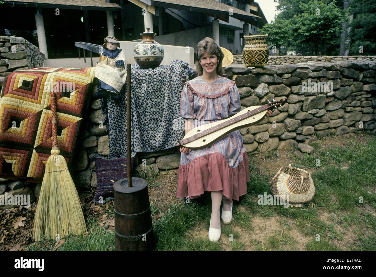 A young mountain girl shows off the arts and crafts of the Southern Highlands Folk Art Museum in Asheville North Carolina Stock Photo