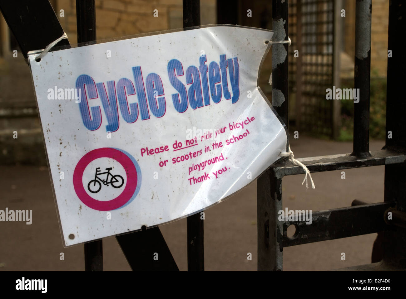 Safety notice on school gate do not ride bicycles or scooters in