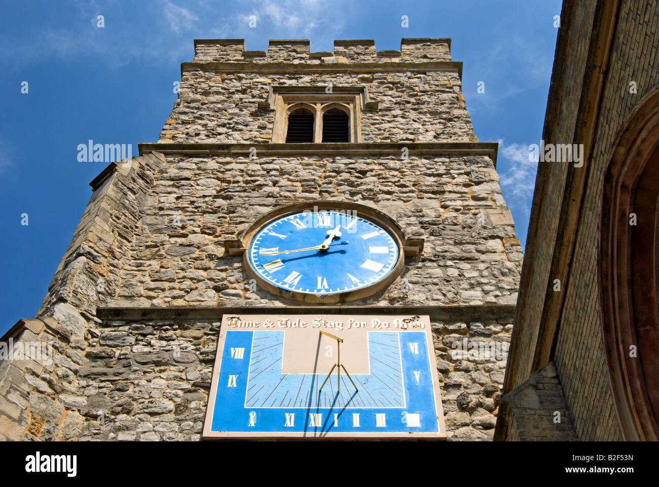 clock and sundial with biblical quotation on the tower of saint mary's