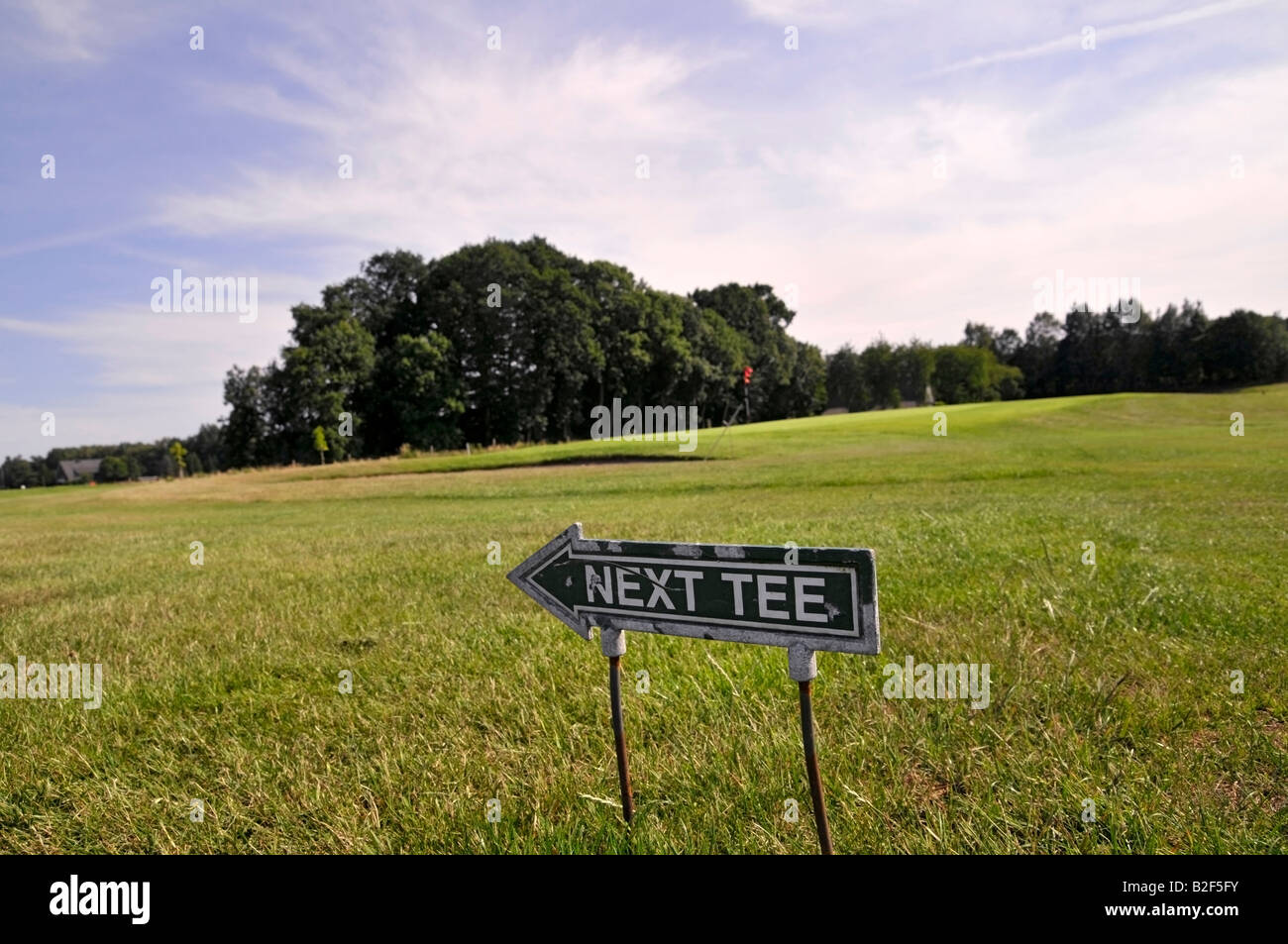 Sign reading Next Tee, golf course Stock Photo