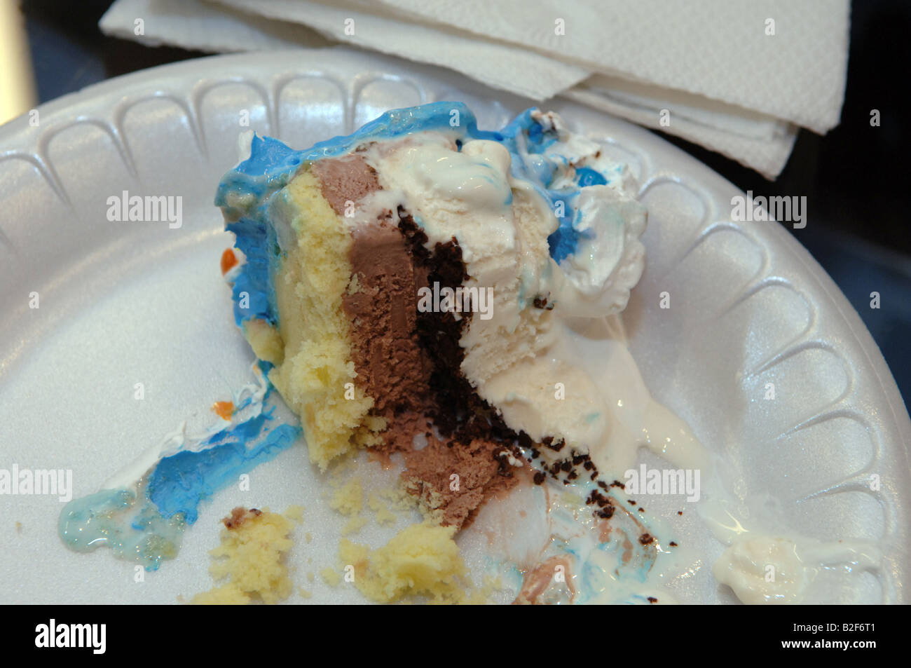 Half eaten slice of ice cream cake Stock Photo