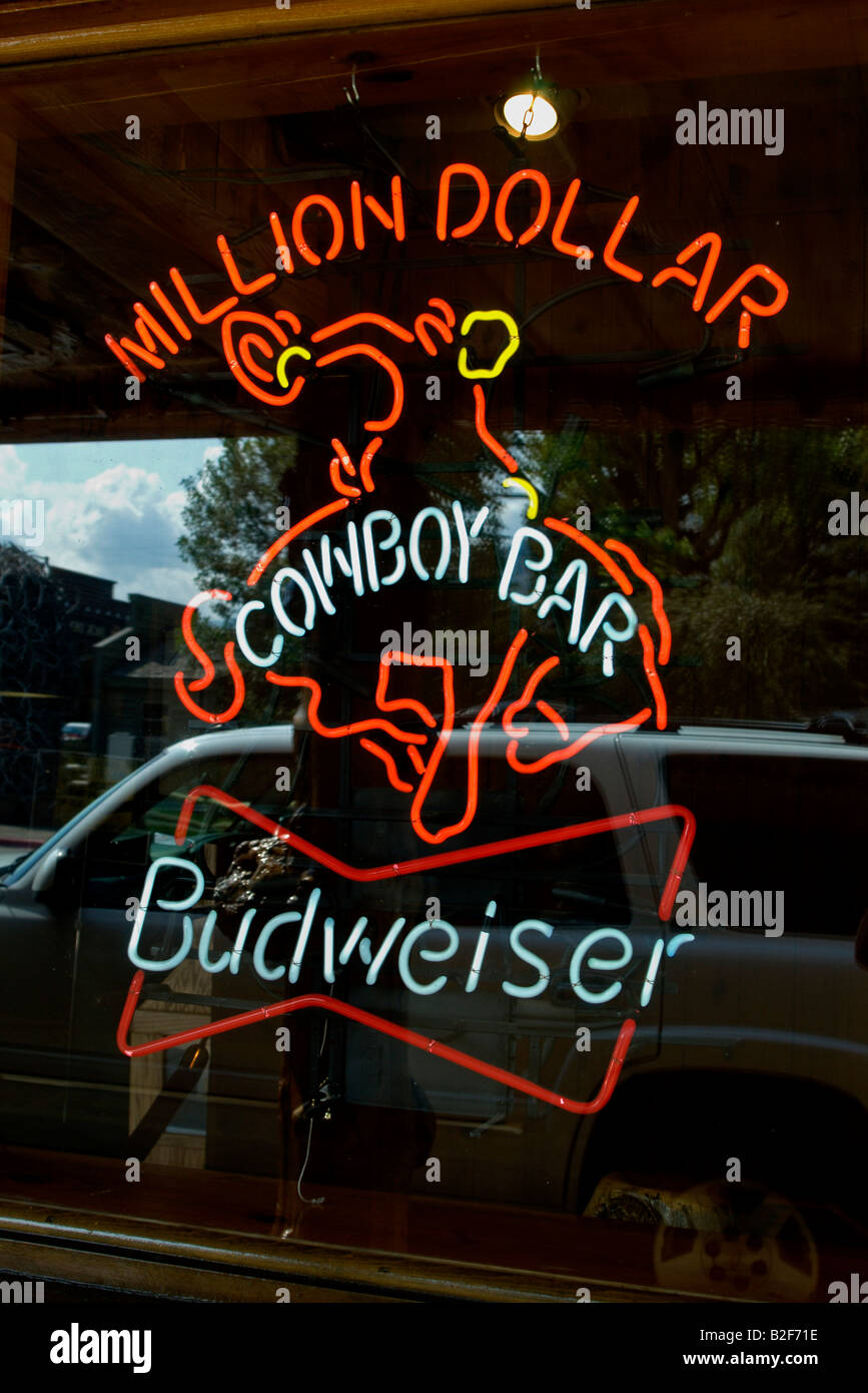 Million dollar cowboy bar neon sign on the window hires stock