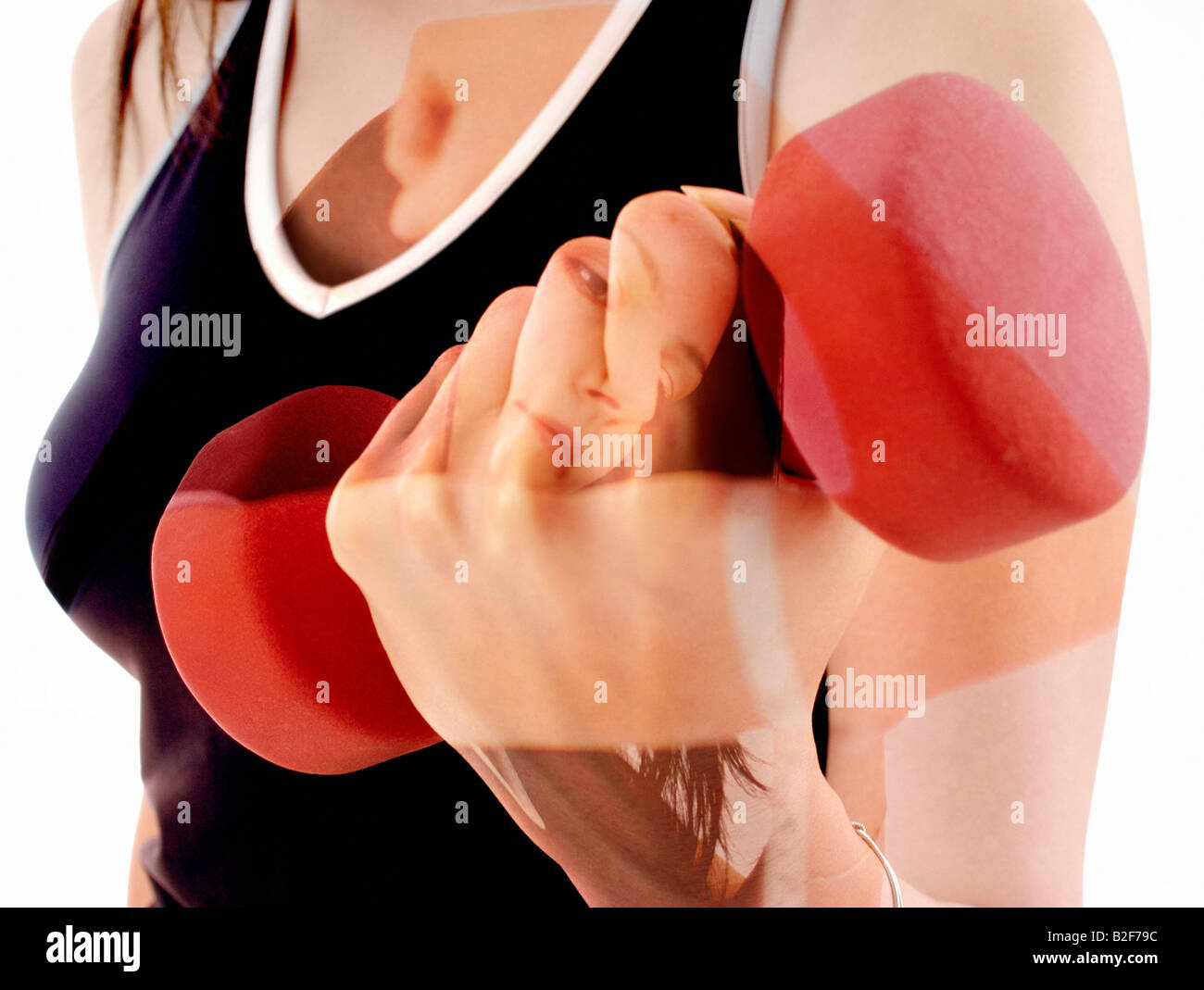 Young woman dumb-bell arms biceps and hand weights Stock Photo