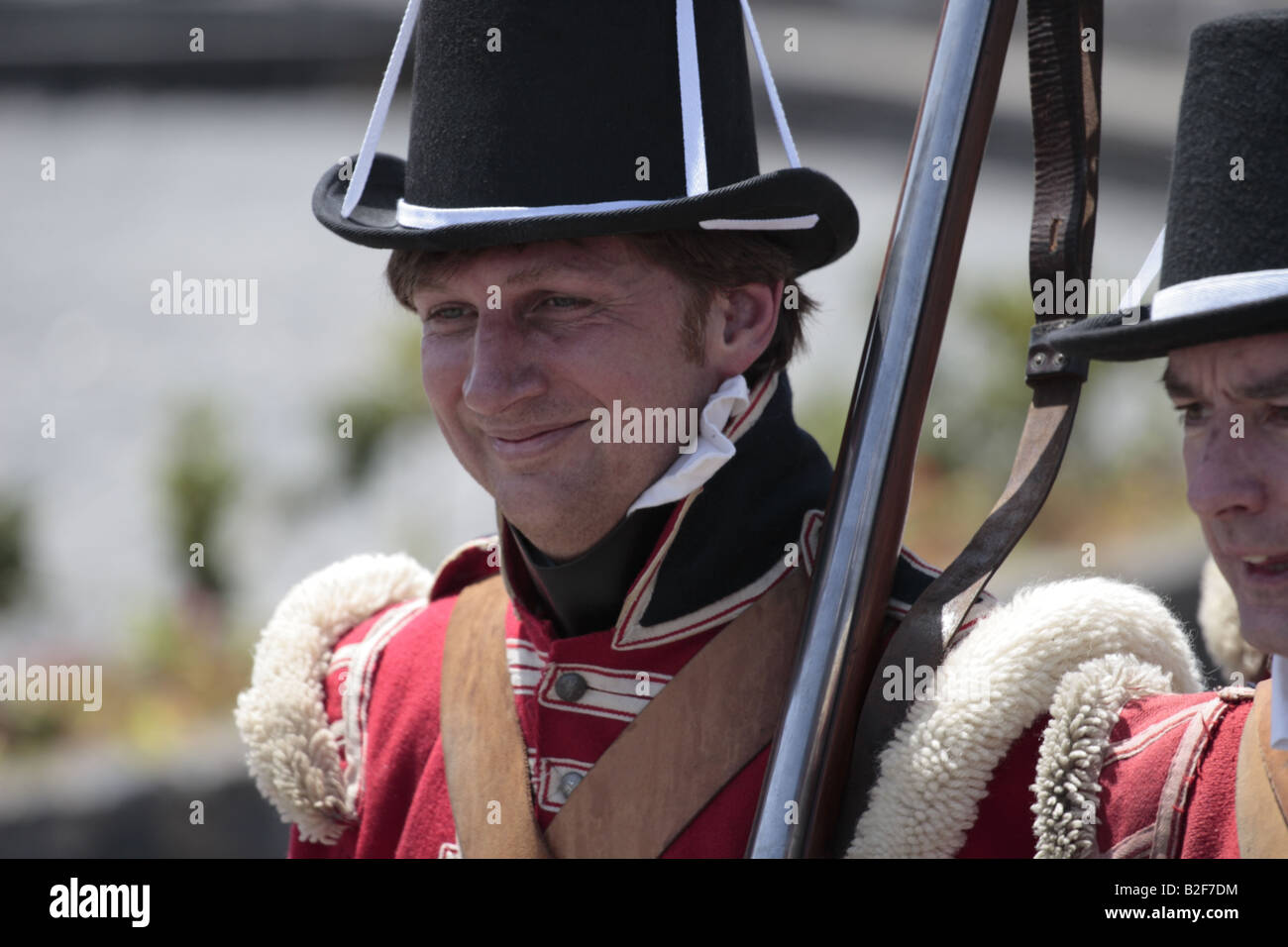 A member of the English forces clearly enjoying himself during a reenactment of the 1797 battle of Santa Cruz, Tenerife Stock Photo