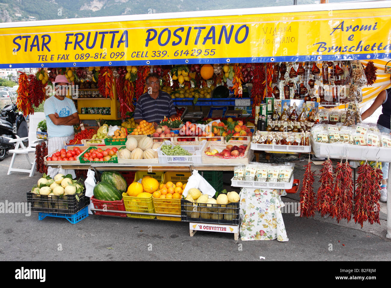 Fruit stall selling fresh produce and hot chilli viagra olive oil. Stock Photo