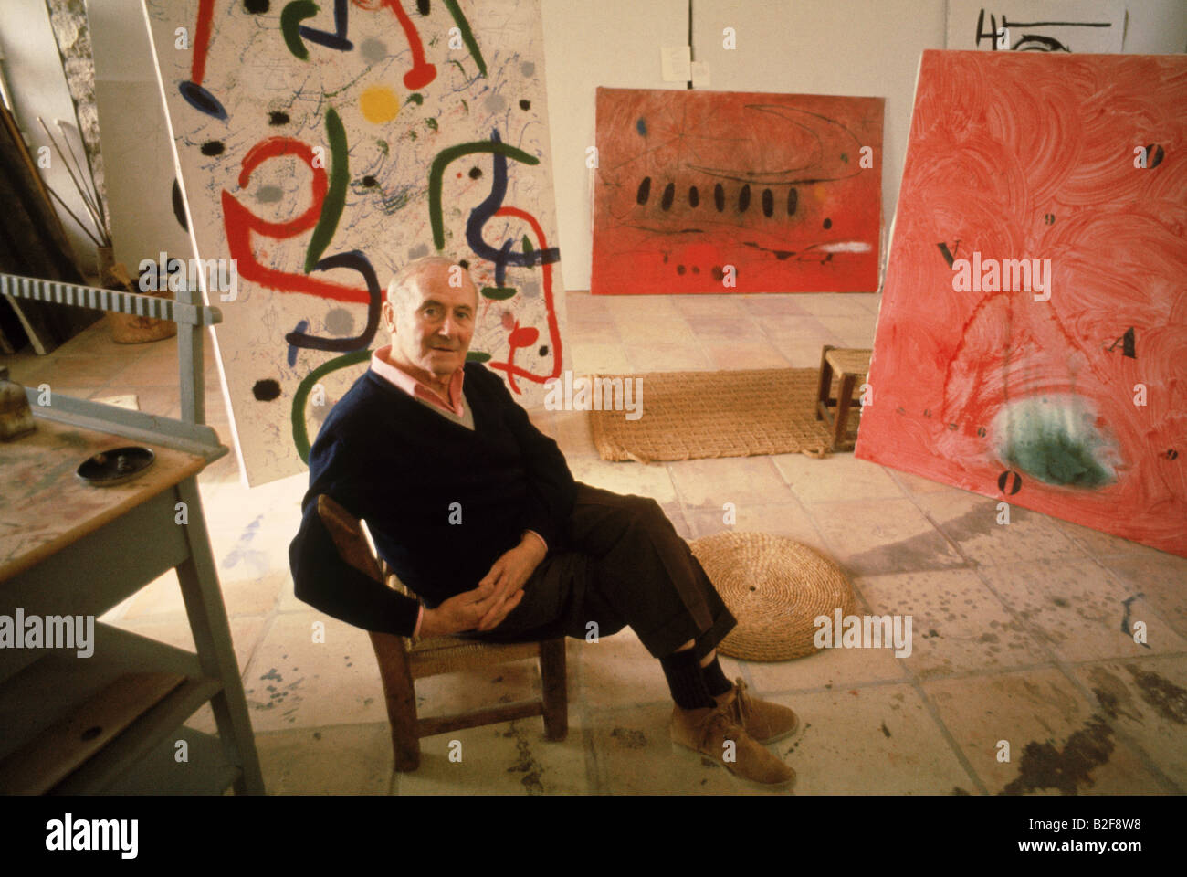 Portrait of Joan Miro, Catalan Spanish artist, among his works. Stock Photo
