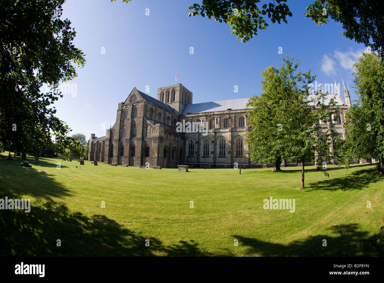 Winchester Cathedral exterior in early sunshine summer morning Hampshire England United Kingdom GB Great Britain British Isles Stock Photo