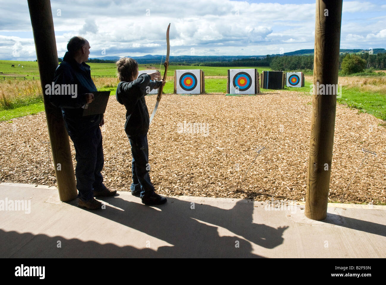 Boy at archery class at holiday centre Stock Photo Alamy