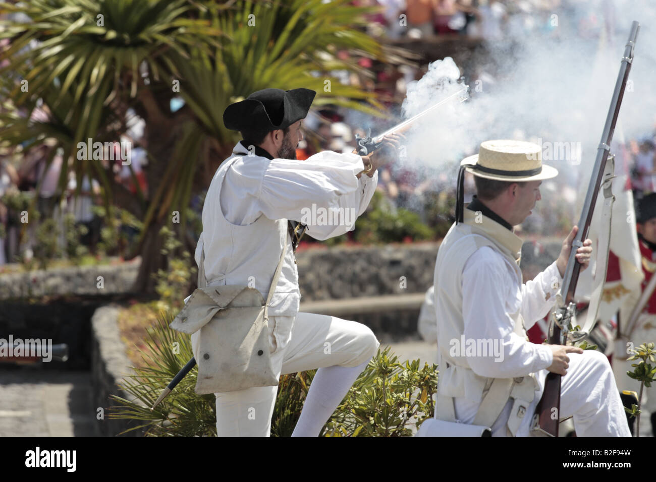 A British Navy sailor fireing his rifle during a reenactment of the 1797 battle of Santa Cruz, Tenerife Stock Photo