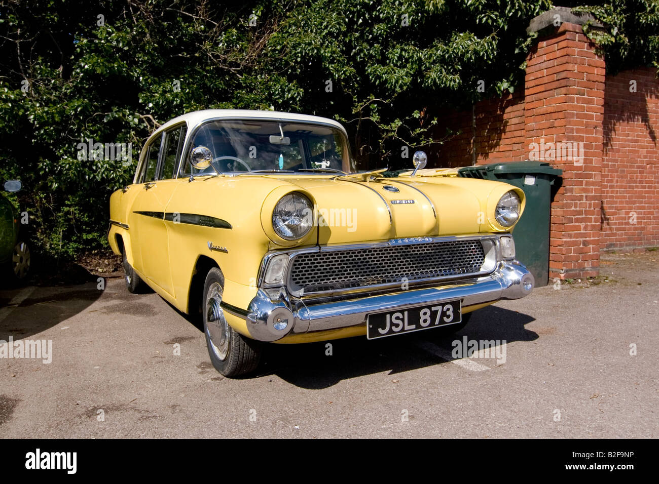 Old-fashioned car parked in driveway, Vauxhall Victor vintage saloon car Stock Photo