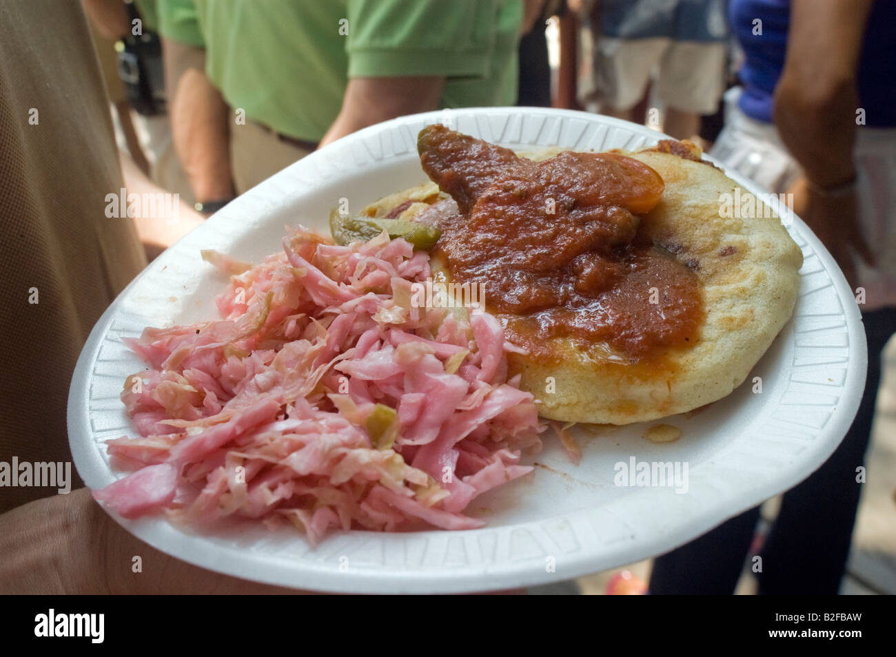 A Salvadorian pupusa with sauce and side orders from the Latin food vendors in the Red Hook neighborhood of Brooklyn in New York Stock Photo
