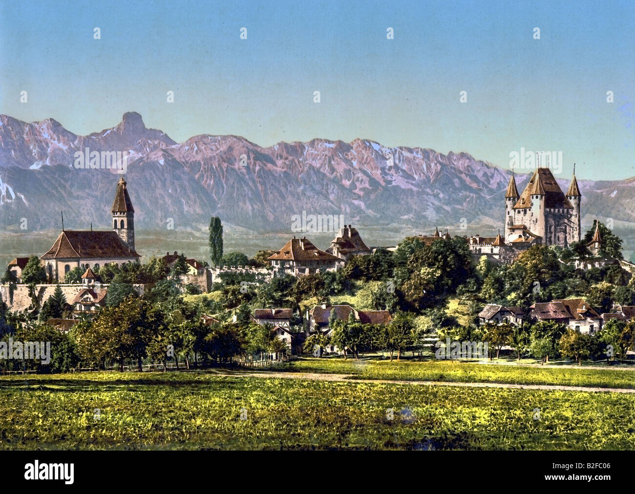 View of the City of Thun with the church and Thun Castle, Mount Stockhorn in the back. Stock Photo