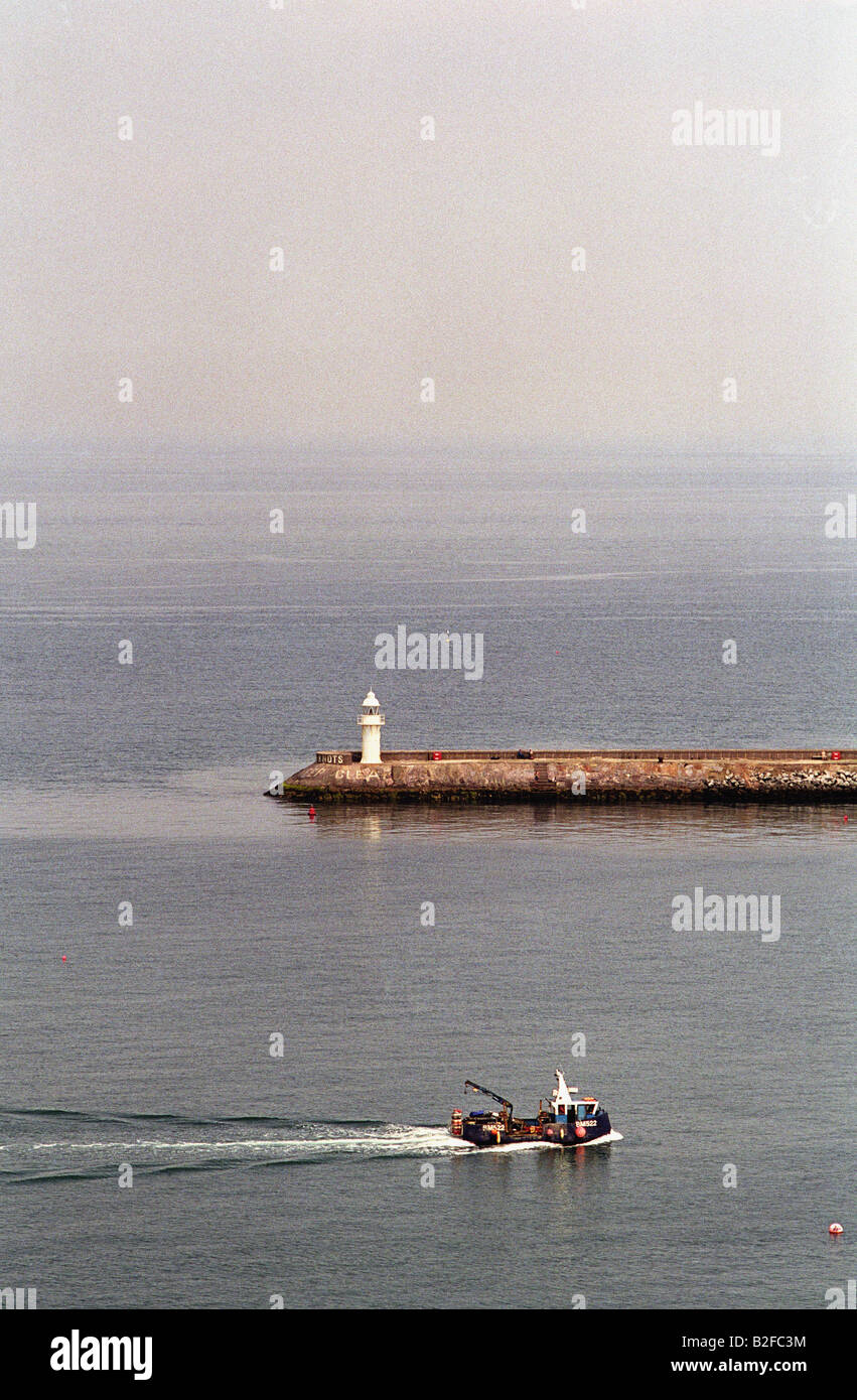 fishing boat entering Brixham harbour Devon England Stock Photo - Alamy
