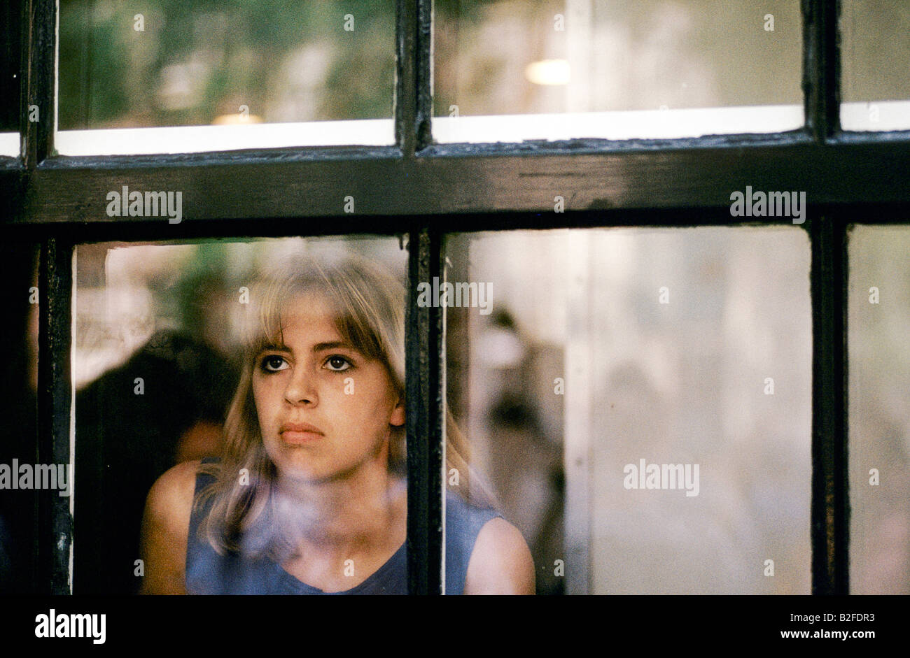 tourist looking through window of the Anne Frank House amsterdam Stock Photo