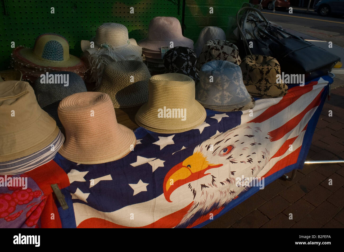 Store in Woodside Queens in New York NY displays an assortment of hats for the summer Stock Photo