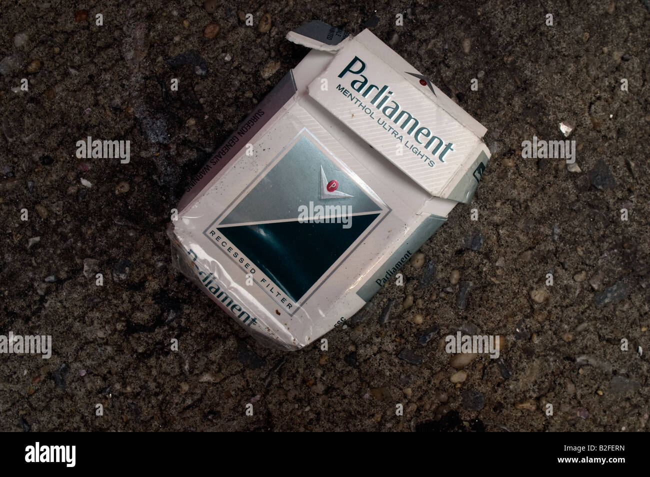 An empty pack of Parliament cigarettes is tossed away on the street in New York NY Stock Photo