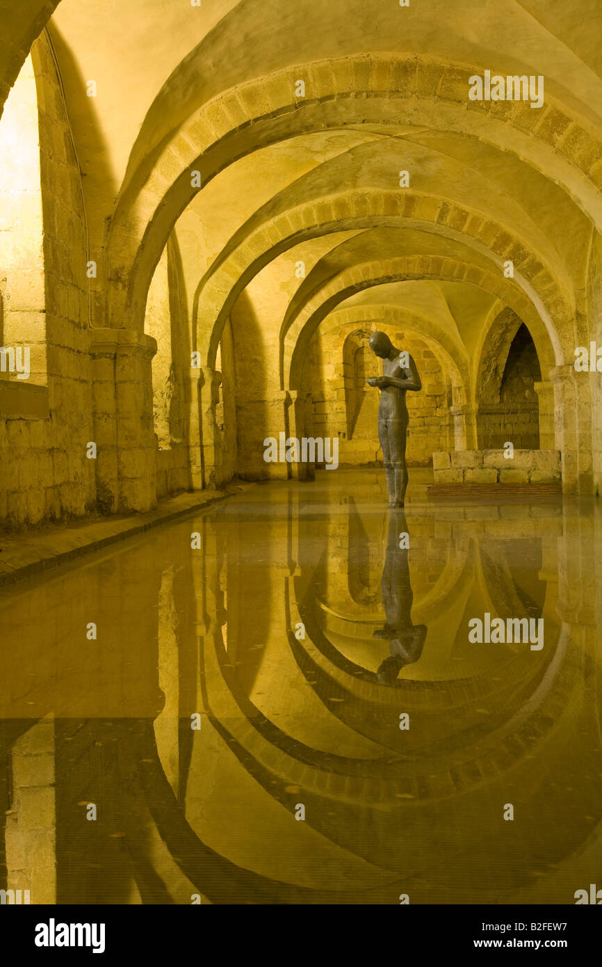 Sound II 2 statue sculpture by Antony Gormley in flooded crypt of Winchester Cathedral Hampshire England United Kingdom GB Stock Photo