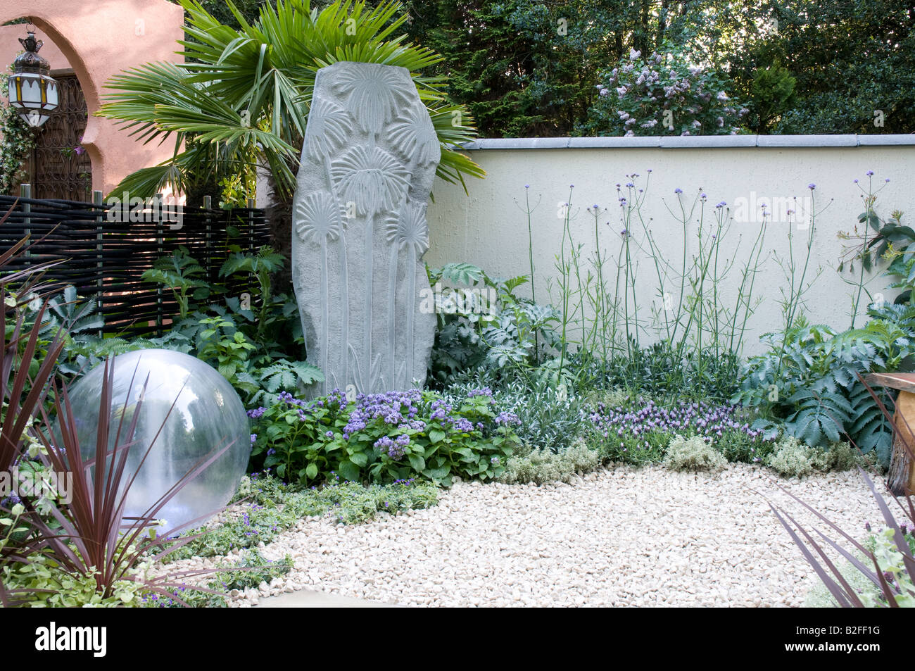Sphere water feature stone wall and ornament Stock Photo Alamy