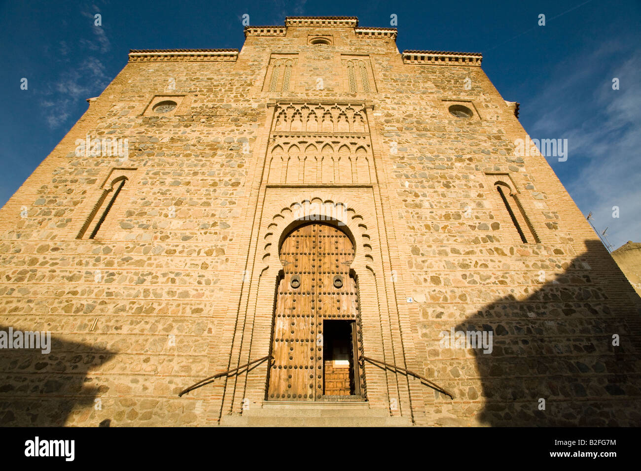 SPAIN Toledo Moorish architectural detail on Igelsia Santiago de Arrobal Mudejar arched entrance to 13th century church Stock Photo