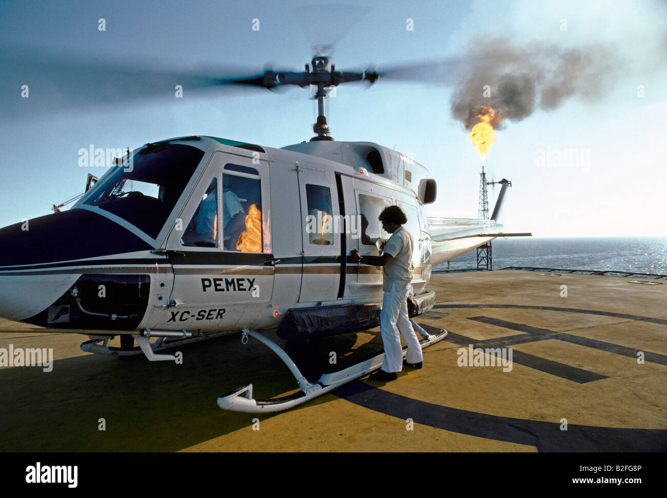helicopter landing at pemex oil rig, gulf of mexico Stock Photo