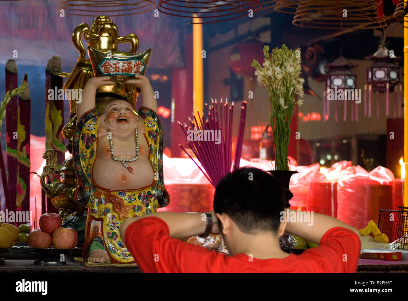 Chinese people pray in the temple at Chinese New Year; main altar of