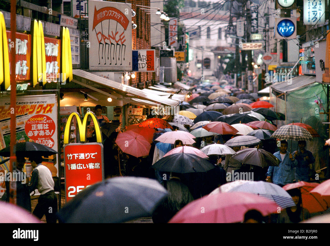 umbrellas on a rainy street in tokyo Stock Photo