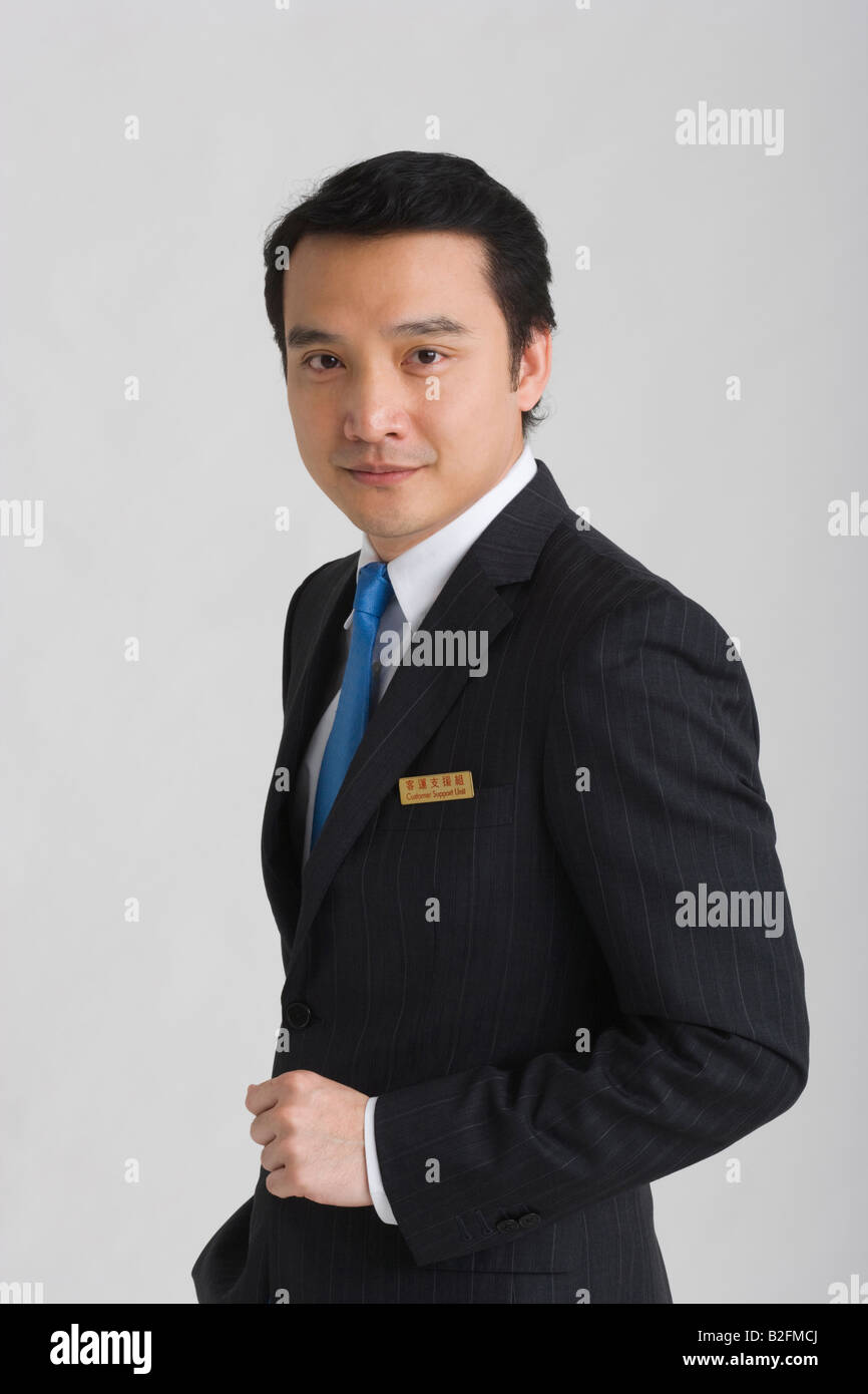 Portrait of a businessman holding a clipboard and smiling Stock Photo Alamy
