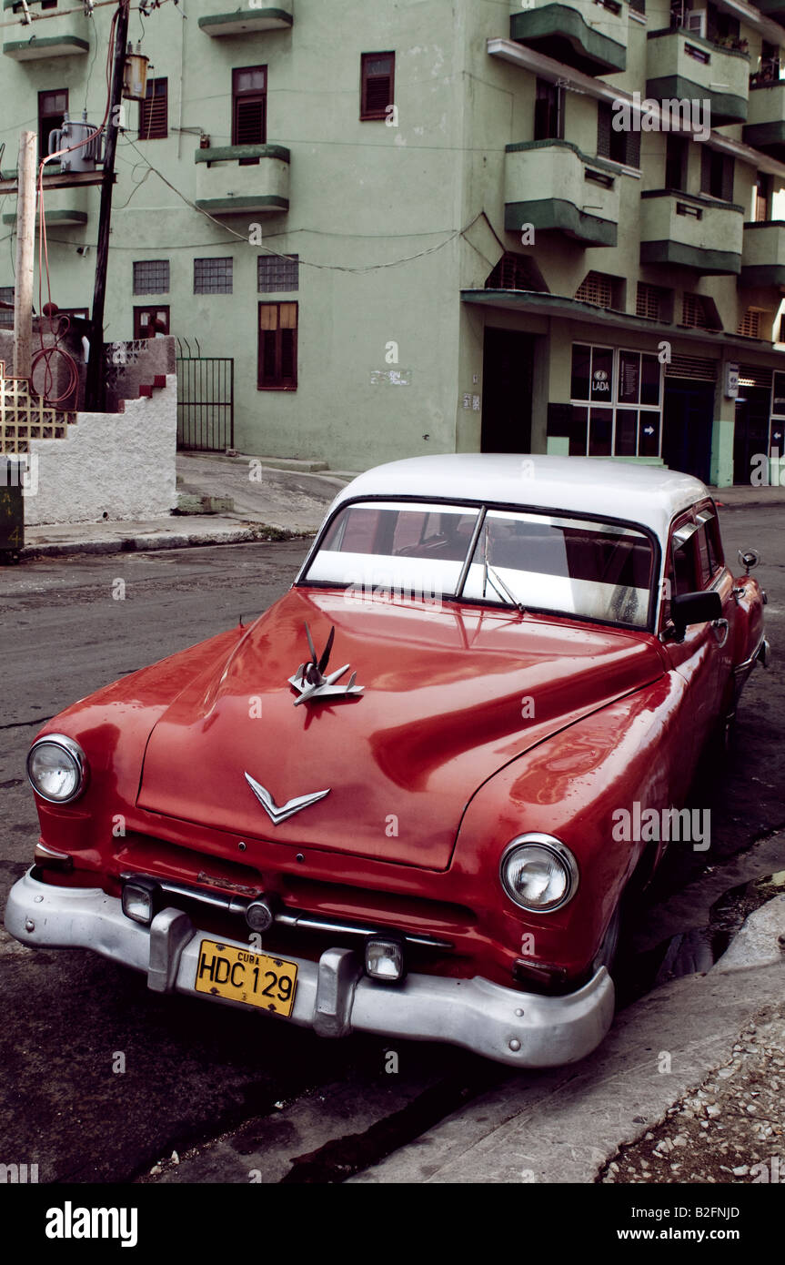 classic red 1950's american car parked in a havana street Stock Photo