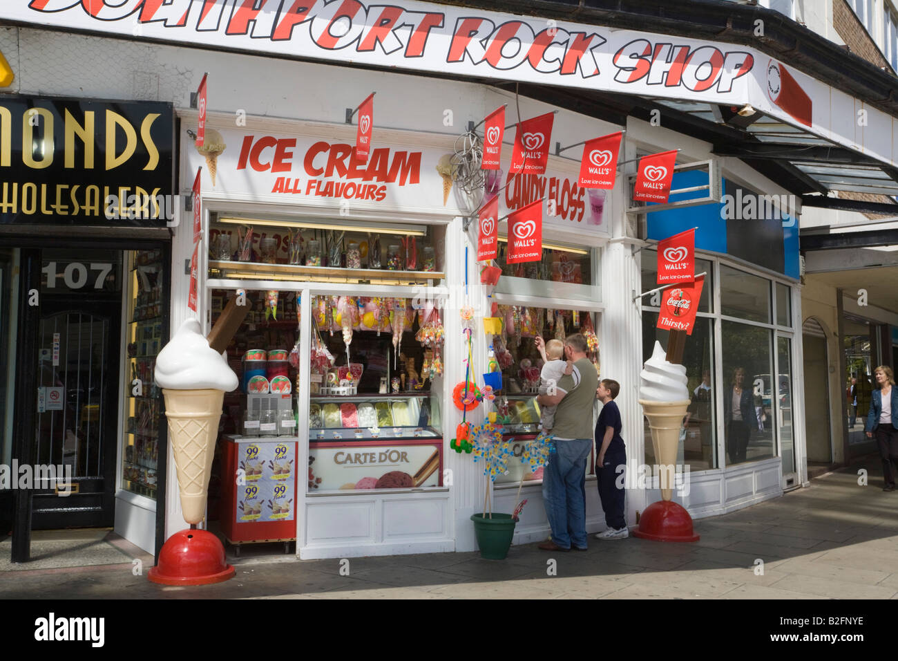 Ice cream and sweet shop with people looking in the window. Southport