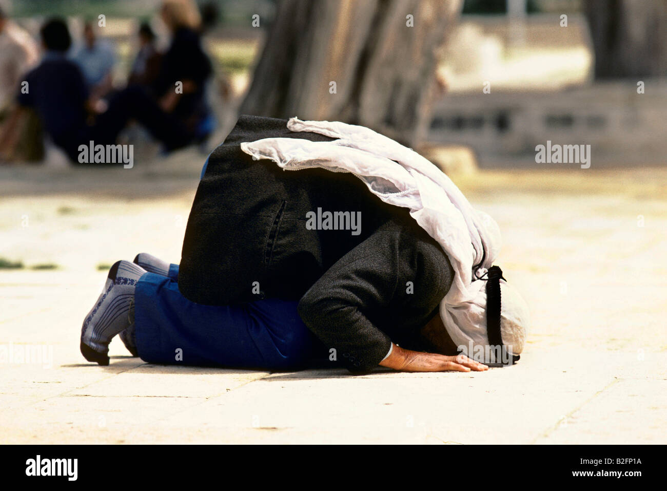muslim man praying at the dome of the rock Stock Photo