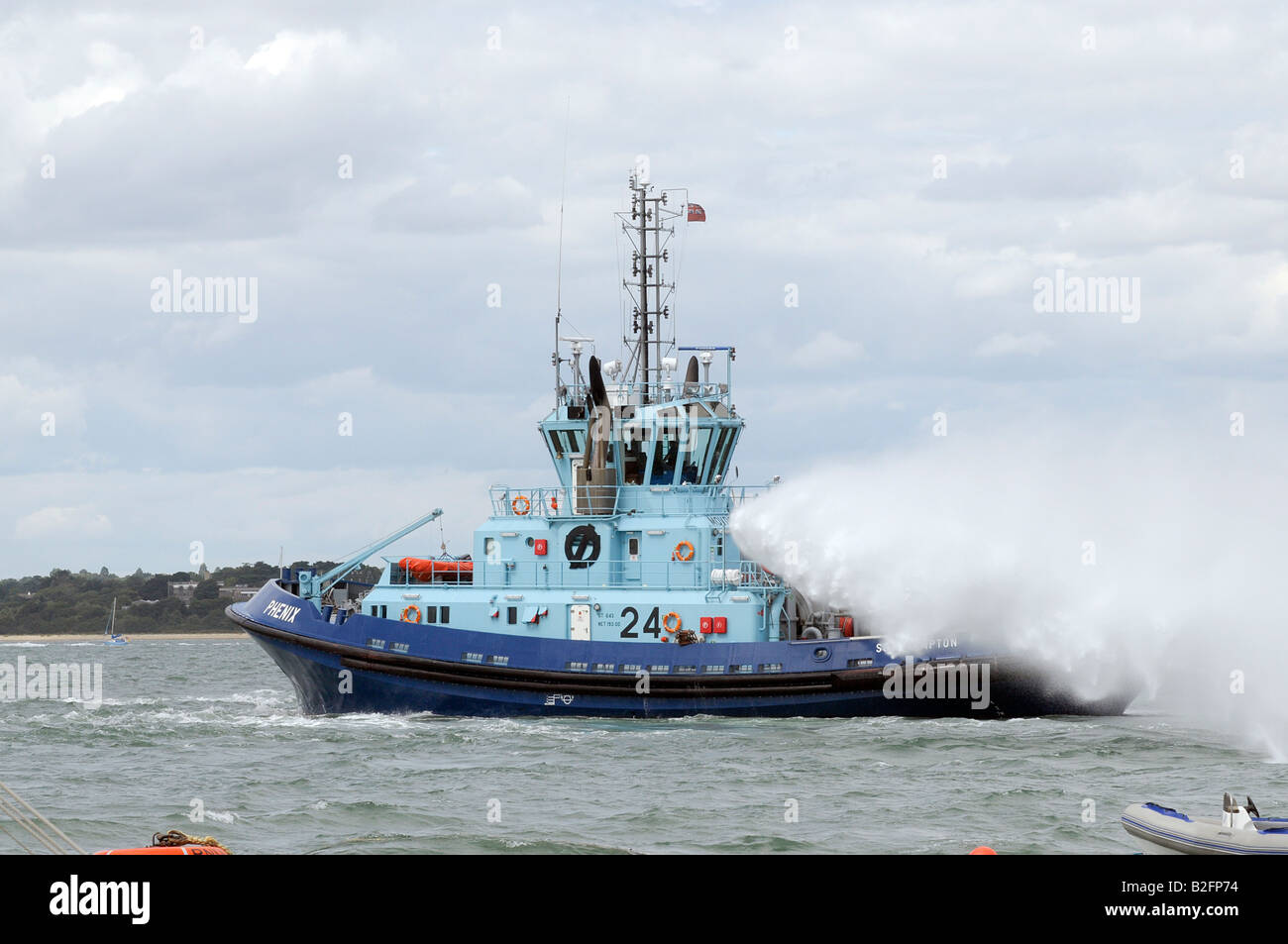 tug boat with fire fighting capabilities designed for towing tankships oil Tankers Stock Photo
