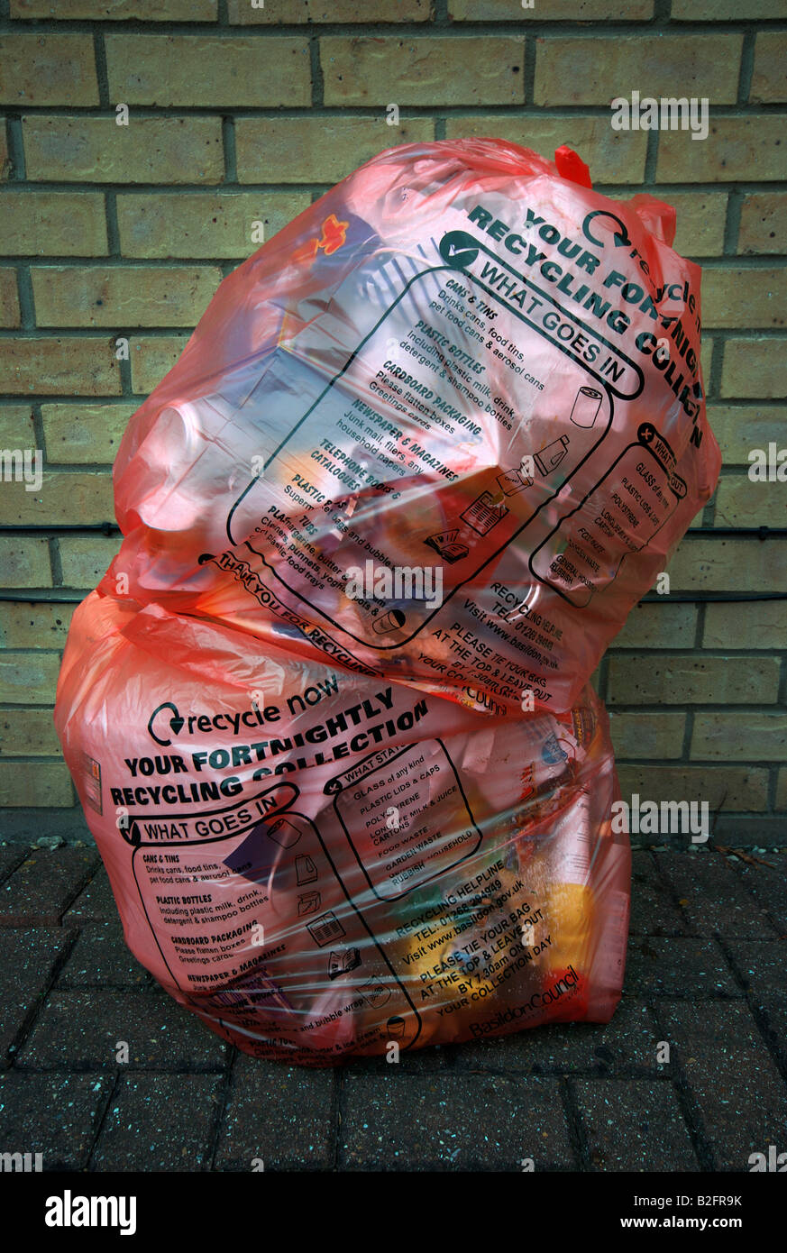 Recycling bags containing rubbish out for collection Stock Photo Alamy