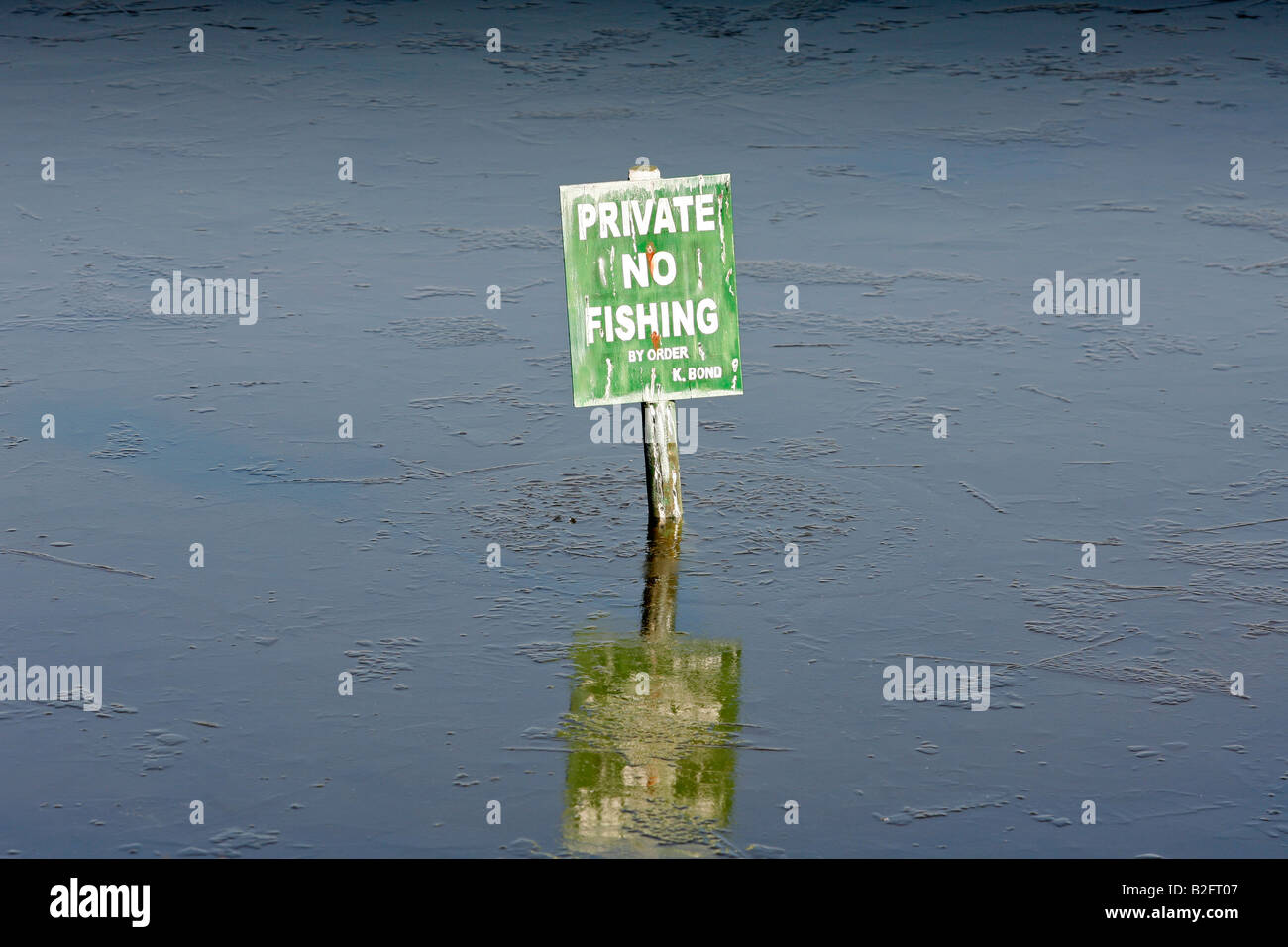 No fishing sign in a lake covered with ice Stock Photo