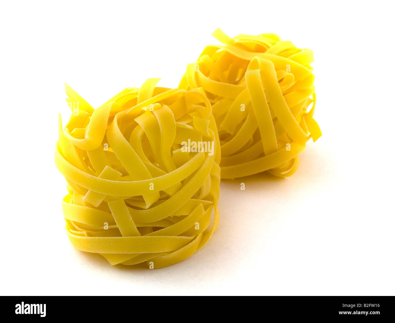 Pasta Tagliatelli on White Background Stock Photo