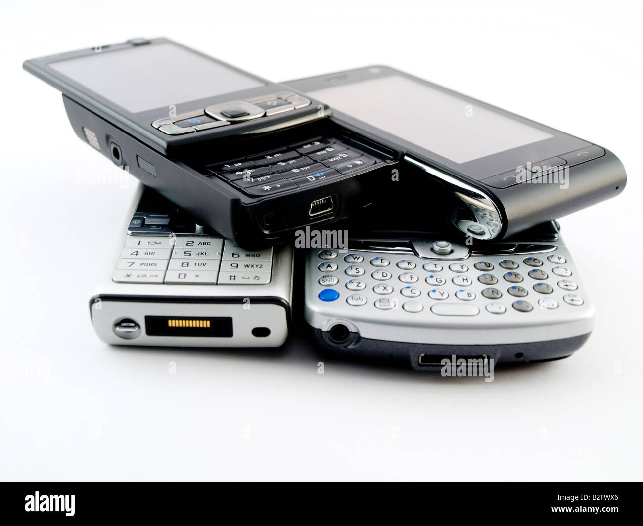 Stack Pile of Several Modern Mobile Phones PDA Cell Handheld Units