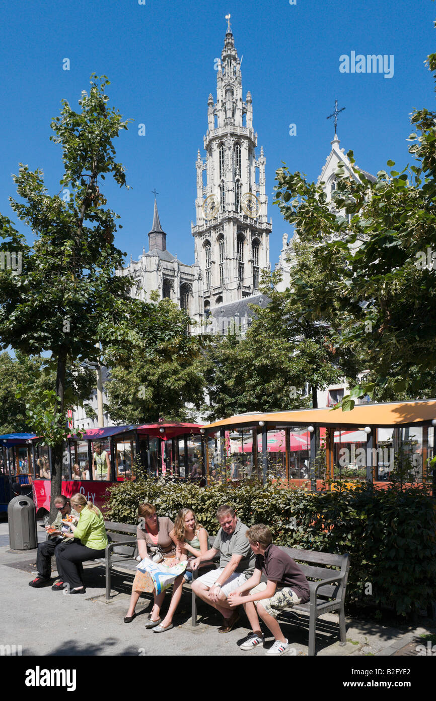 Family on park bench in Groenplaats with Onze Lieve Vrouwekathedraal behind, the centre of the old town, Antwerp, Belgium Stock Photo