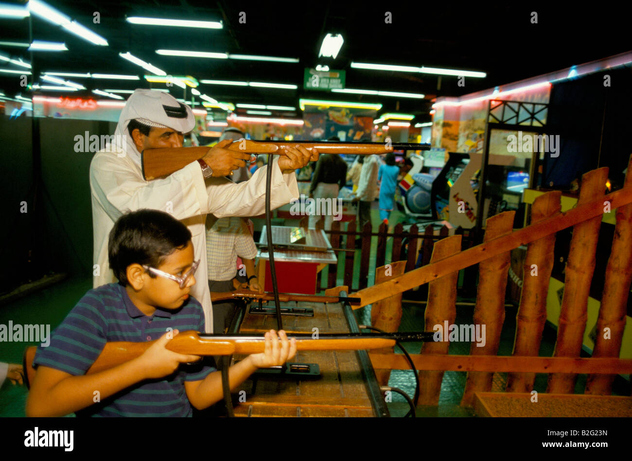 a boy and a man shooting toy guns, sinbads amusment centre, dubai Stock  Photo - Alamy