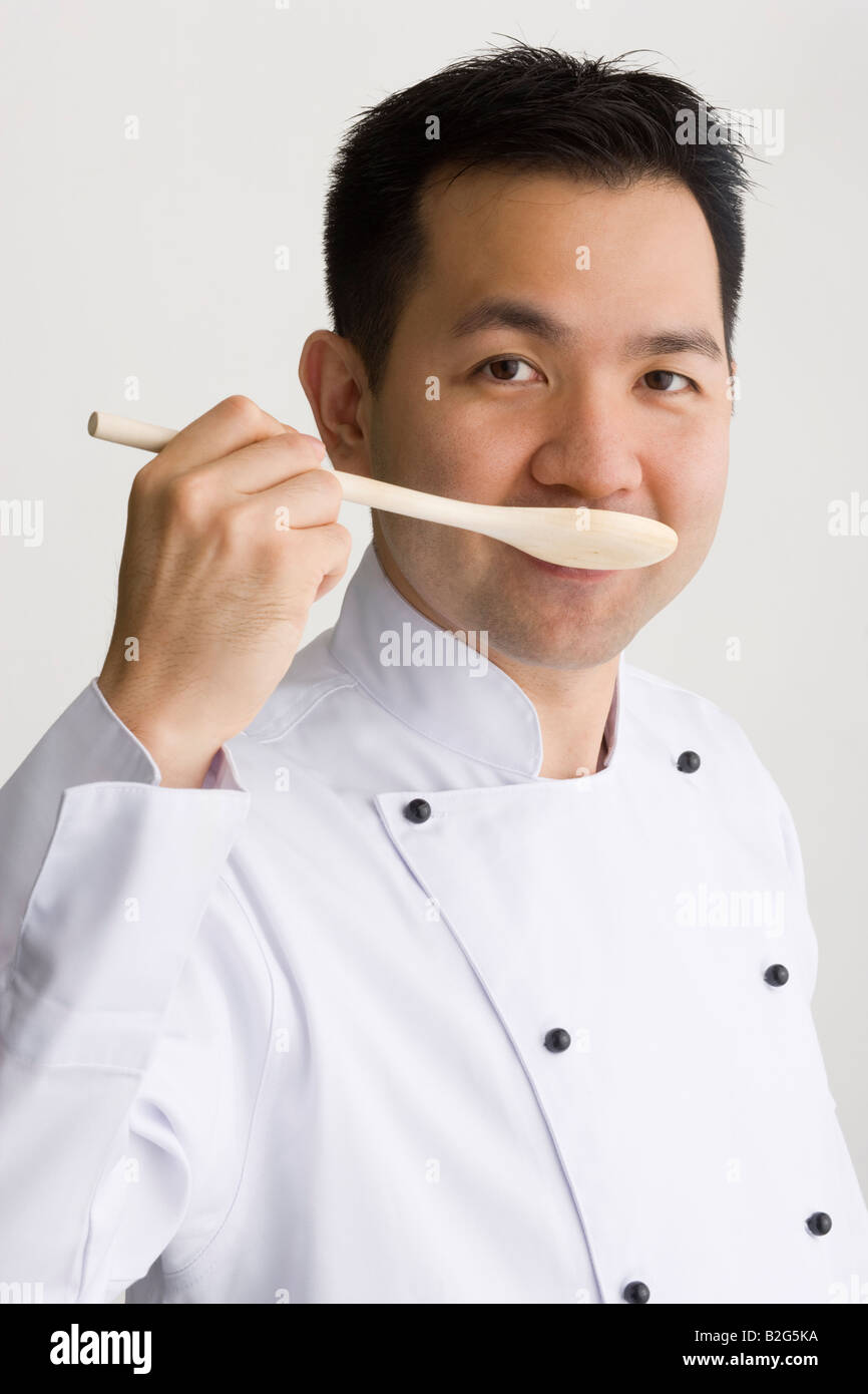 Portrait of a male chef tasting food Stock Photo Alamy