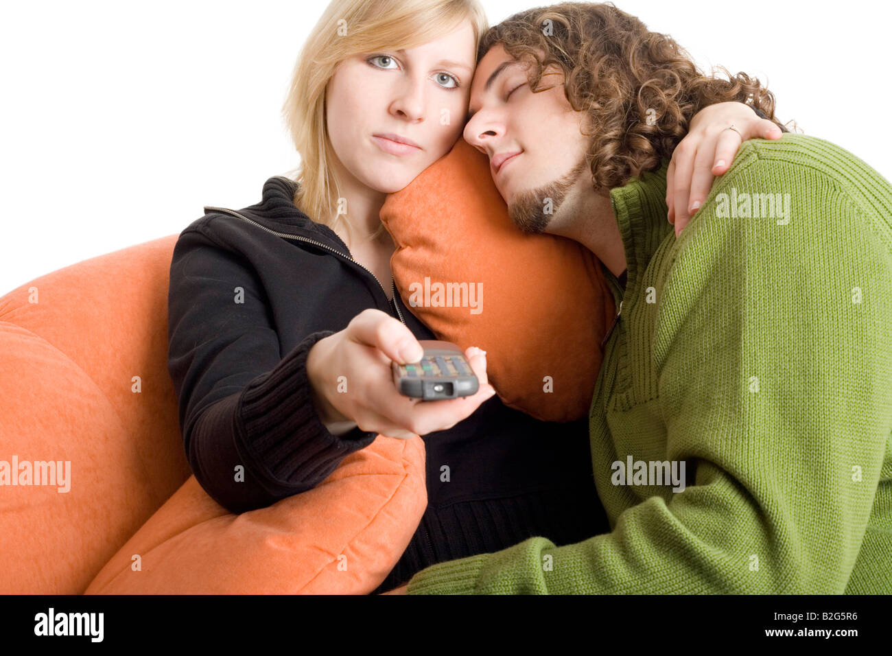 couple pair tv remote control shifting chanel surfing Stock Photo