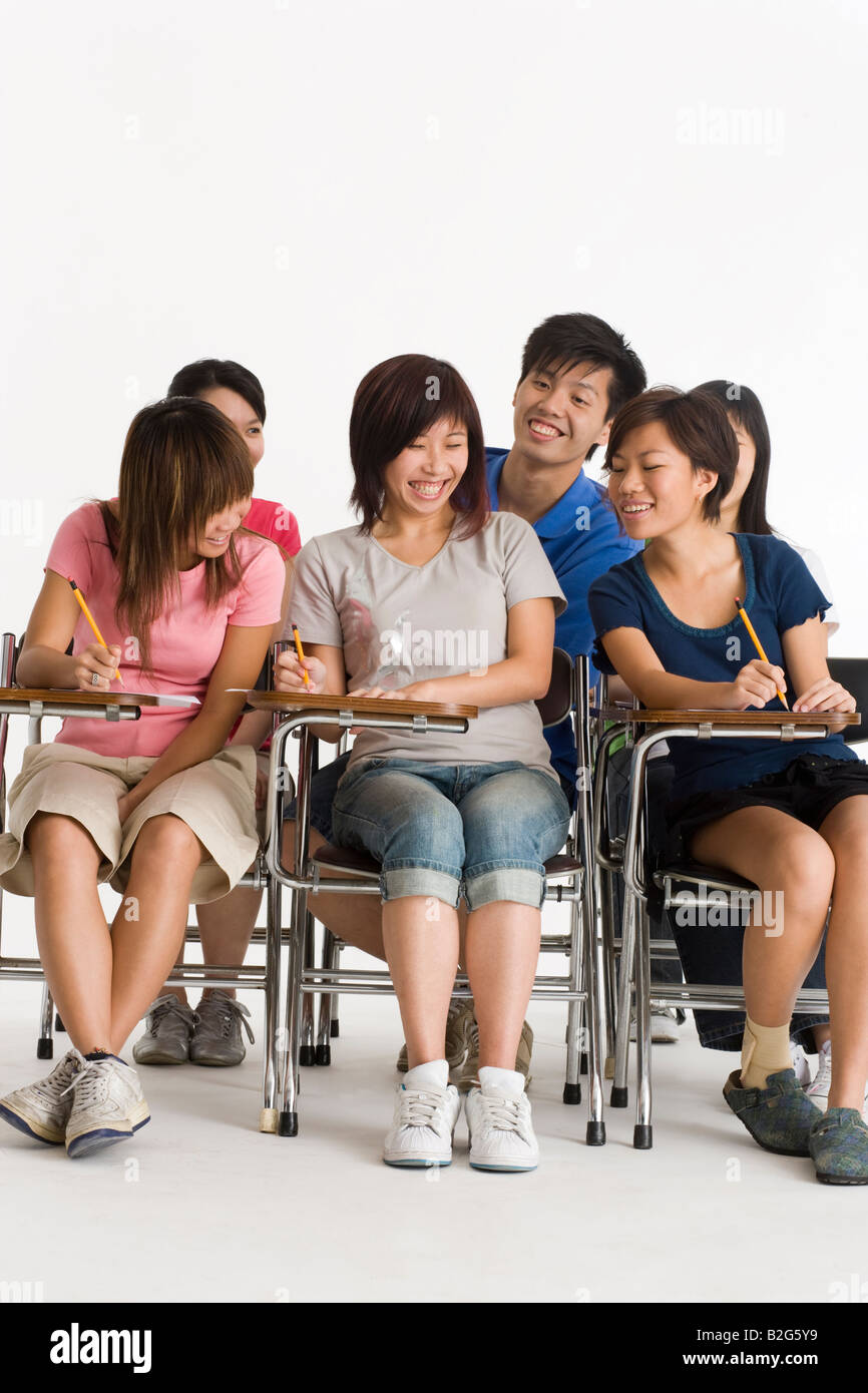Group of college students giving exam in a classroom Stock Photo