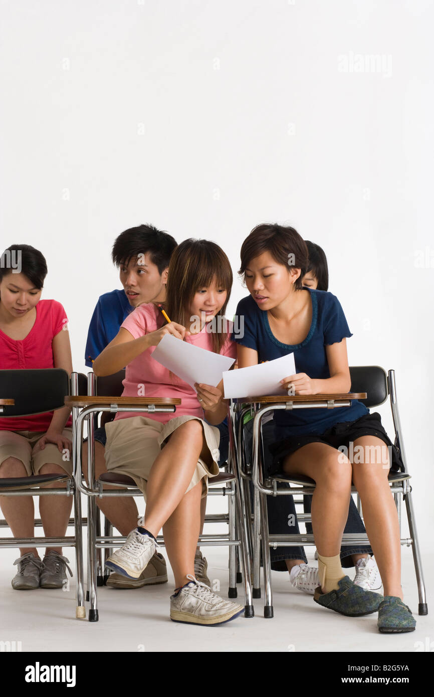 Group of college students giving exam in a classroom Stock Photo
