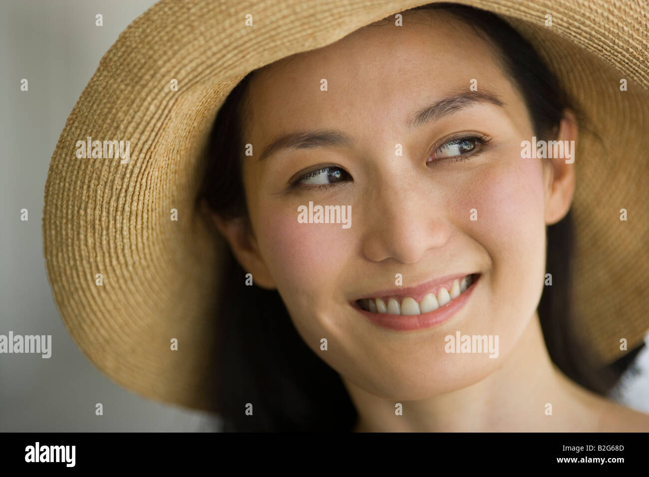 Close-up of a young woman smiling Stock Photo - Alamy