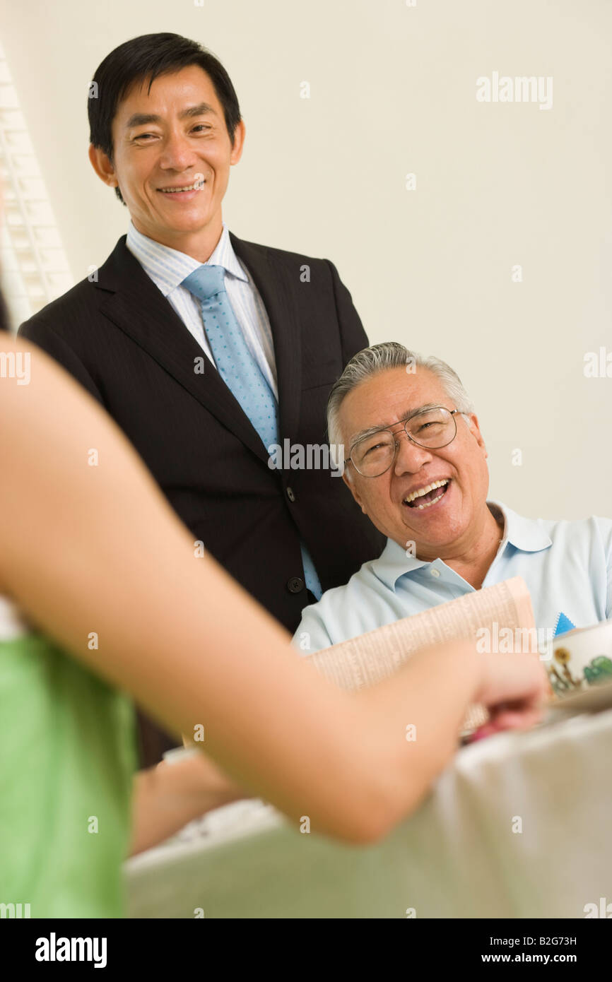 Family at a breakfast table Stock Photo - Alamy