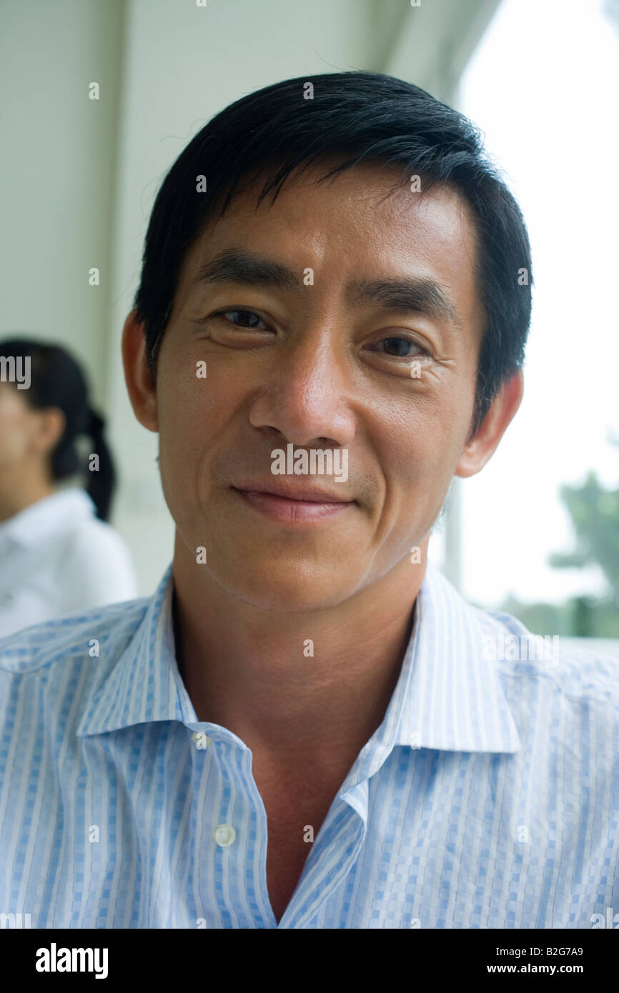 Portrait of a mid adult man smiling Stock Photo - Alamy