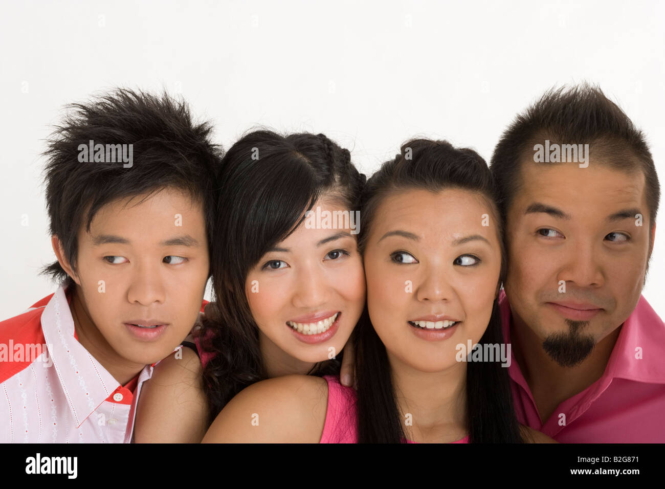Close-up of two young men with two young women Stock Photo - Alamy