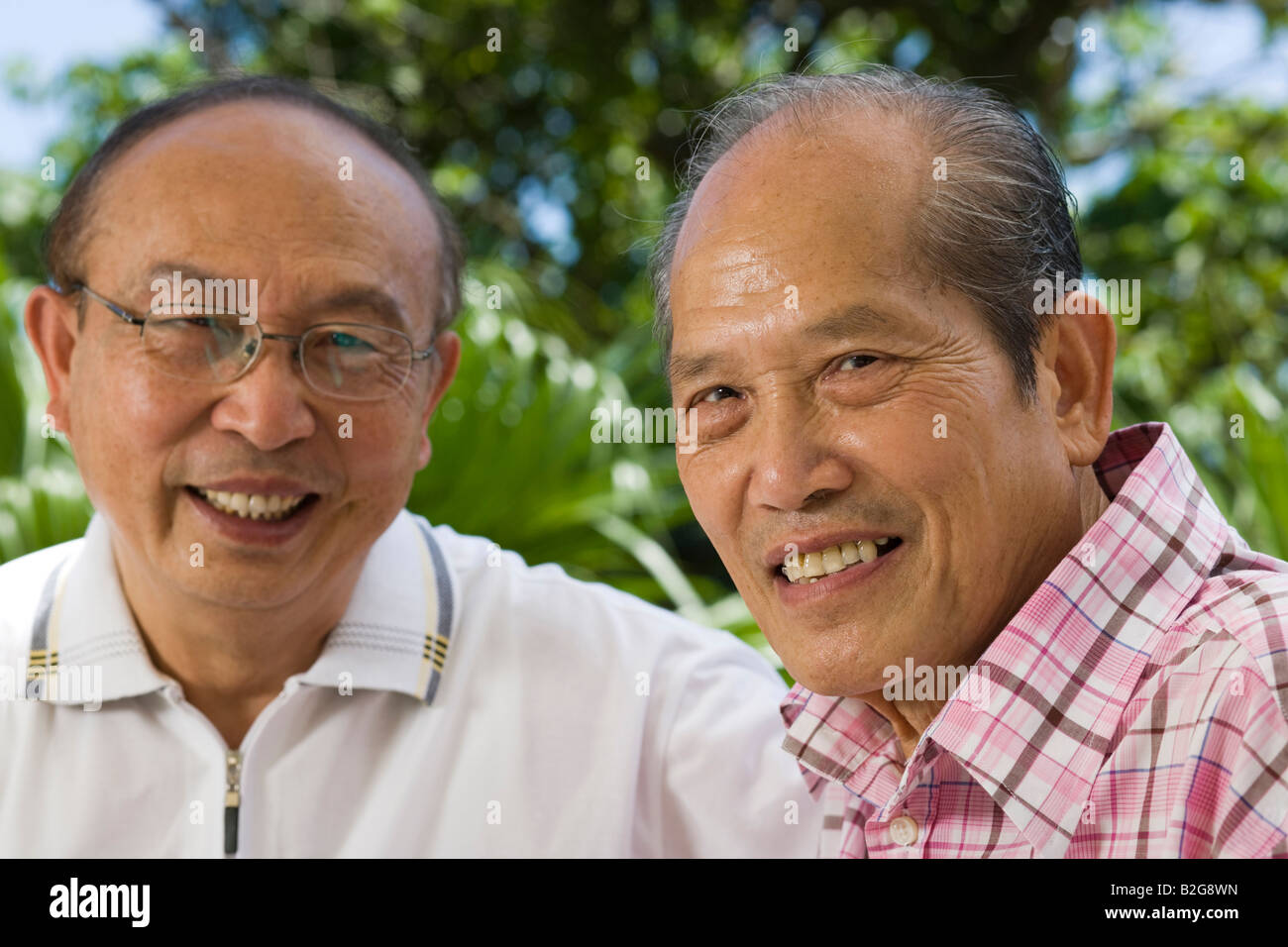 Portrait of two senior men smiling Stock Photo