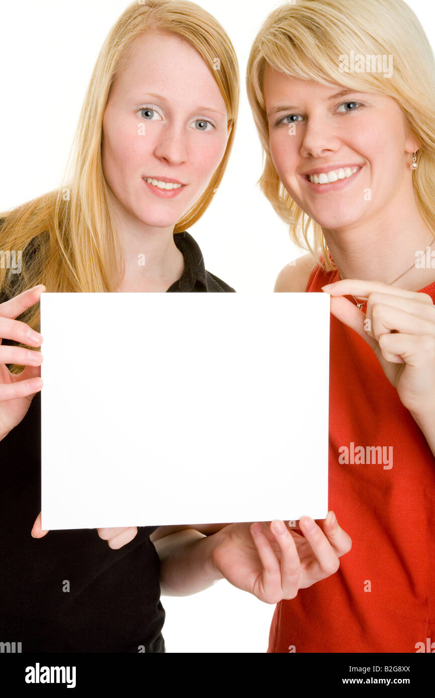 pair couple young women paper sign Stock Photo