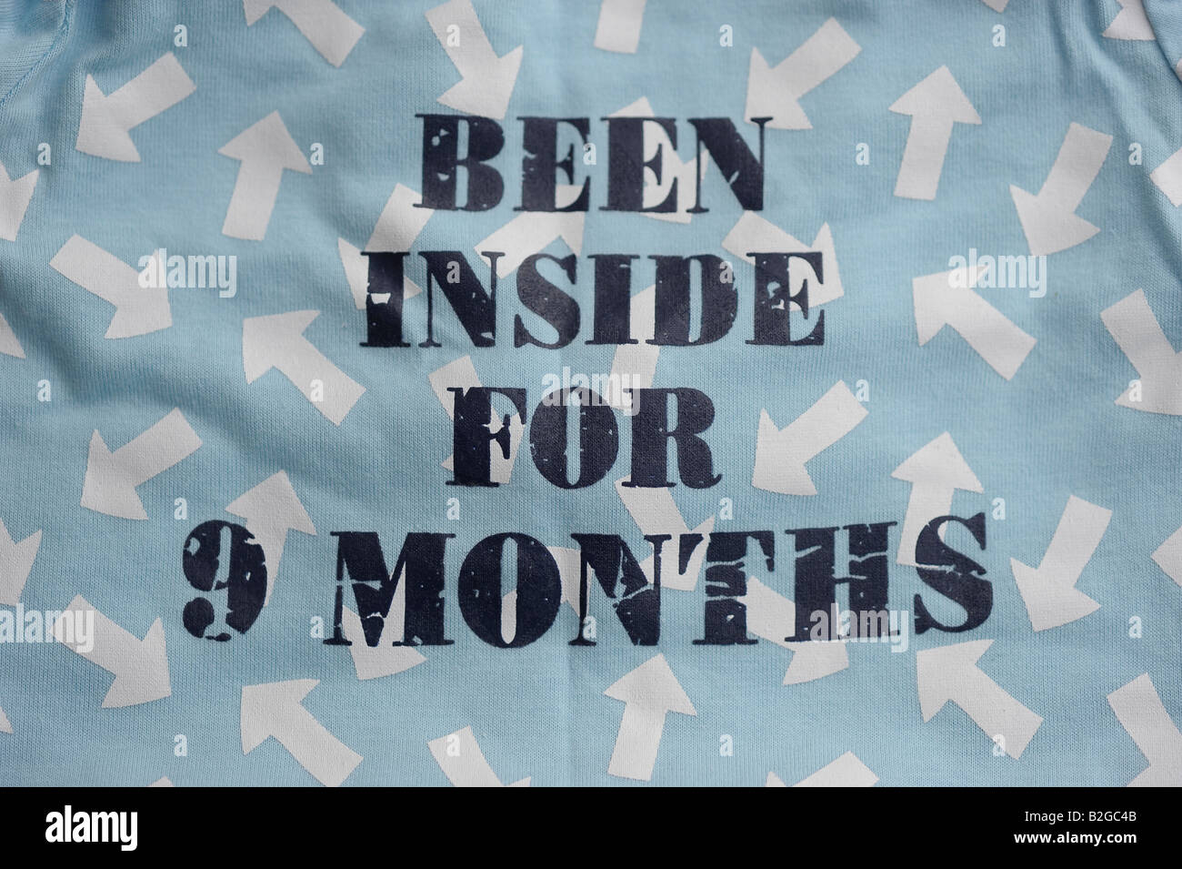 been inside for nine months comic humour baby clothes prisoner jailbird funny Stock Photo